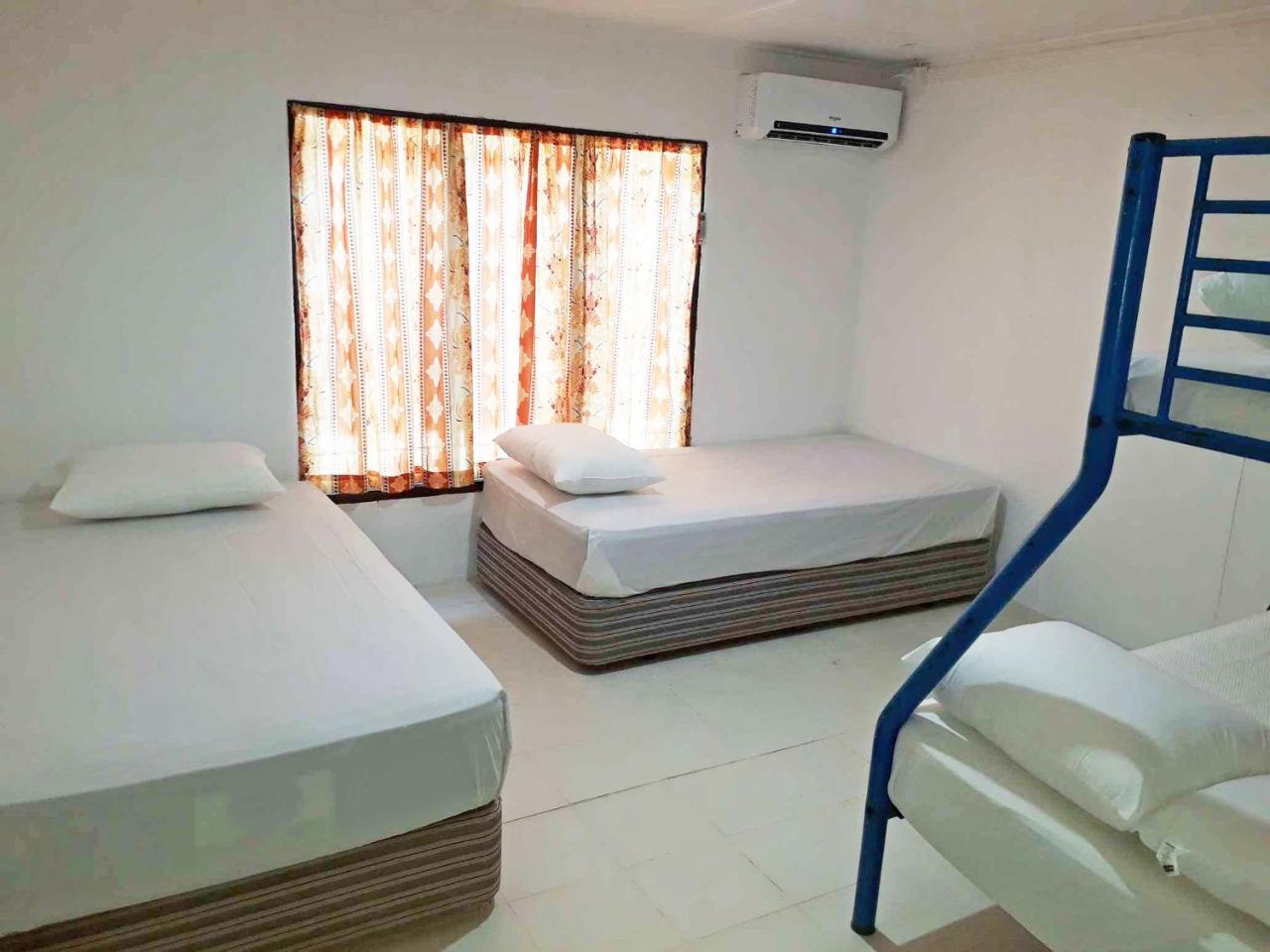 Ratu Kini Backpackers And Dive Resort Mana Buitenkant foto